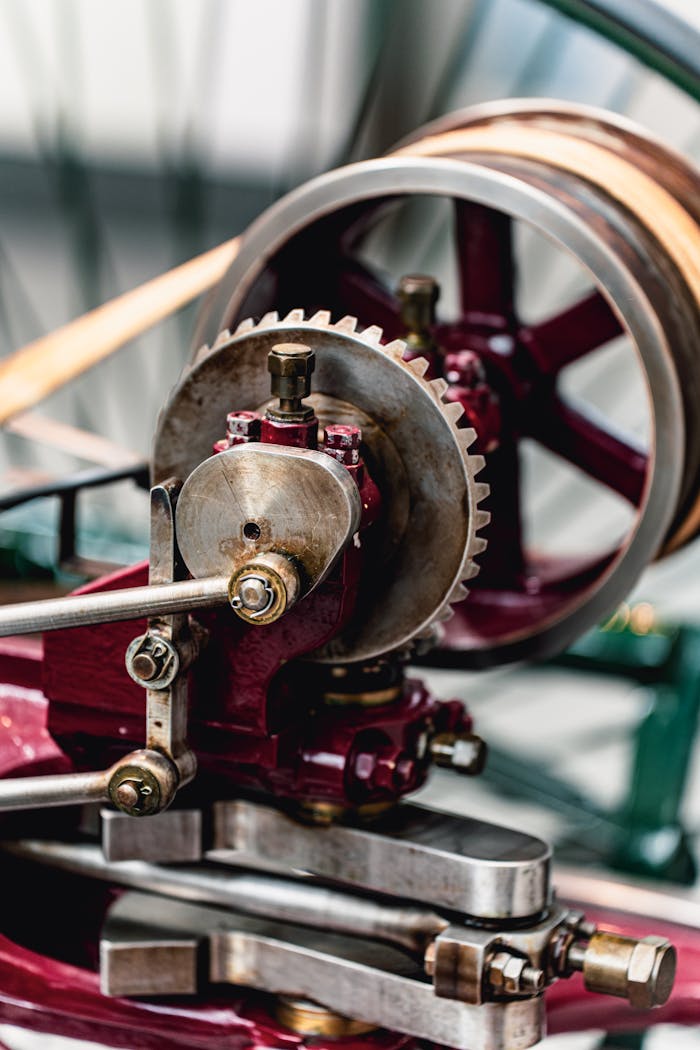 Detailed view of a vintage industrial machine gear showcasing complex mechanical components and engineering design.